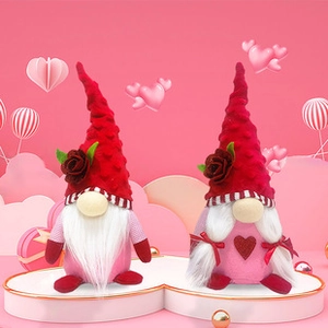 Detail of pink and red Valentine's Day gnomes featuring roses and heart patterns