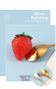 Close-up of mirror-polished stainless steel dessert spoon with gold and silver finishes