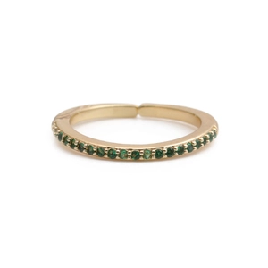 Detail of 18K gold open ring with micro-pave set round green cubic zirconia stones