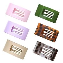 Set of six rectangular acrylic hair clips in various solid colors and patterns.