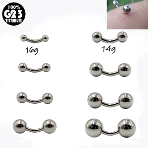 Macro detail of G23 titanium curved barbells in 14g and 16g sizes for eyebrow piercings