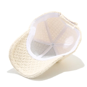 Detailed inner view of knit baseball cap showing white sweatband and woven texture