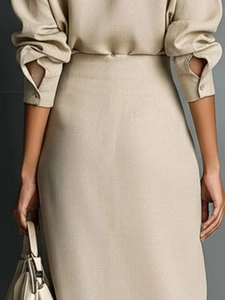 Elegant long sleeve shirt and midi skirt set in beige linen blend from a back view