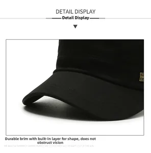 Detail of a black cotton cadet cap showing reinforced stitching and a curved brim