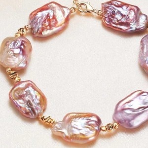 Elegant gold plated baroque freshwater pearl bracelet with iridescent purple luster