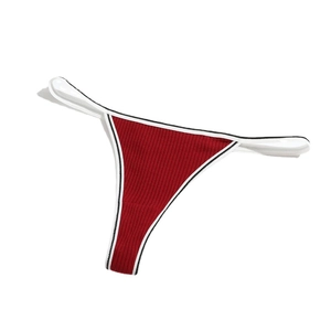 Red ribbed cotton T-back thong for women with contrast piping on a clean white background