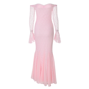 Close-up of pink lace evening dress showing bell sleeves and mermaid hemline details