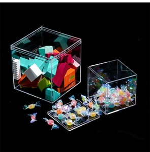 Close-up of clear square acrylic display boxes showing high transparency and dustproof lid