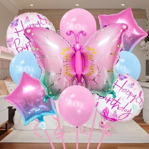 Detail of pink gradient butterfly balloon and star foil balloons for birthday party decor
