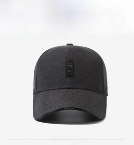 Detail of dark grey baseball cap featuring Sport patch and high-density twill fabric texture