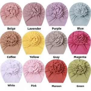 Macro detail of elastic ribbed baby turban hats in twelve different vibrant color options