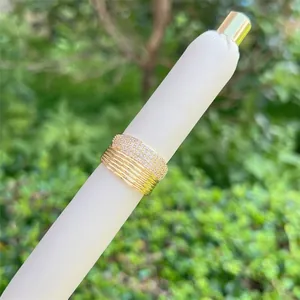 Detailed view of layered 18K gold plated mesh ring with sparkling zircon inlays