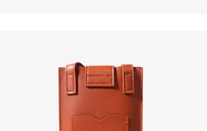 Detail view of the brown leather phone bag showing stitching and top flap structure
