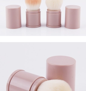 Macro detail of retractable blush brushes in nude pink with soft fiber bristles