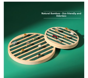 Bamboo jewelry trays with green velvet slots for rings and studs display setup