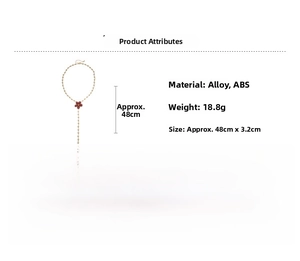 Detail showing golden alloy sweater necklace with floral pendant and tassel dimensions