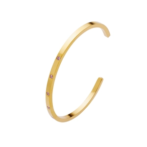 Detail of 18k gold plated stainless steel C-shape bangle with pink zircon stones