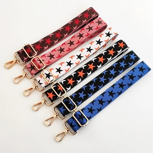 Detail view of colorful star pattern wide adjustable shoulder straps with gold hooks