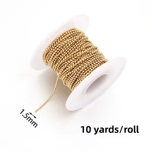 Detail of 1.5mm golden stainless steel bead chain on a 10 yards white plastic spool