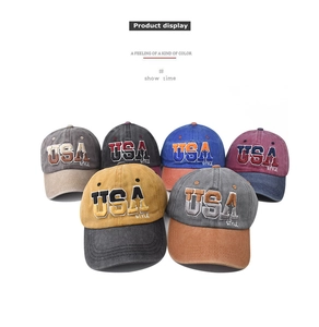 Close-up of vintage washed baseball caps with premium 3D USA embroidery in various colors