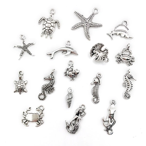 Detailed view of 15 silver-plated ocean charms including starfish and sea turtle