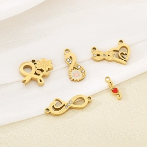 Macro shot of 18K gold plated infinity charms with heart and sunflower enamel detail