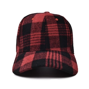 Detail of red and black buffalo plaid wool baseball cap showing premium fabric texture