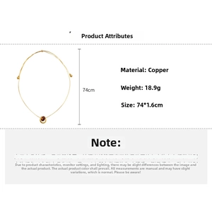 Close-up of gold plated copper necklace with U-shaped pendant, 18.9g weight and 74cm length