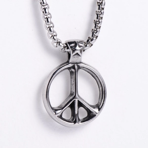 Detail of peace symbol pendant in stainless steel with star link on square box chain
