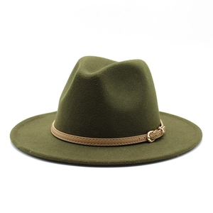 Close-up of dark green wool jazz hat featuring a brown leather band and gold buckle