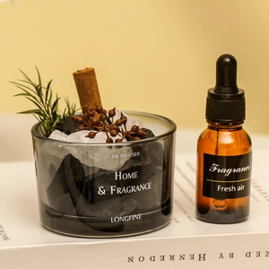 Crystal stone and cinnamon stick oil diffuser set with fragrance oil in a glass bottle