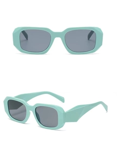 Detail view of mint green chunky rectangular sunglasses with dark grey polarized lenses
