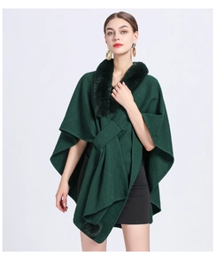 Close-up of the plush faux rabbit fur collar on a dark green knitted poncho cardigan