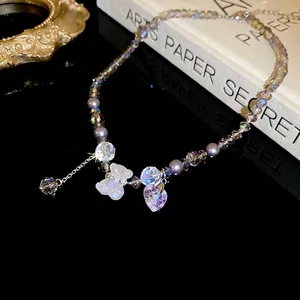 Charming purple beaded necklace with crystal bear, butterfly charm and heart pendant
