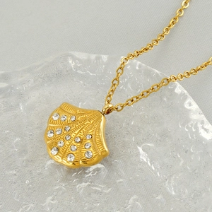 Luxurious gold stainless steel shell pendant necklace with diamonds on water ripple glass