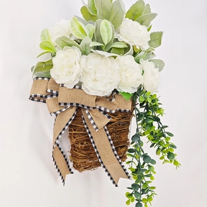 Close-up of white peony door basket with lamb's ear leaves and burlap ribbon