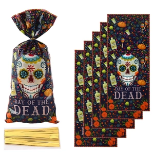 Detail of Day of the Dead candy bags with colorful skulls and golden twist ties
