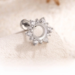 Close-up of 6mm snowflake ear stud setting with white zircon in silver titanium steel