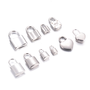 Macro view of assorted mini stainless steel locks in rectangle and heart shapes