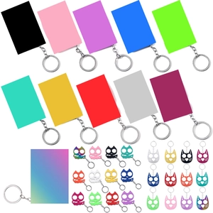 Colorful set of cat-shaped and rectangular survival keychains on white background