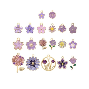 Detailed flat lay of purple enamel flower charms with gold edges for jewelry making