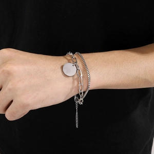 Double-layered stainless steel chain bracelet with a polished round disc pendant for women