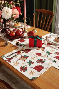 Detail of Christmas table runner with festive gift box and berry patterns on wood