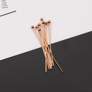 Close-up of rose gold stainless steel headpins for DIY jewelry making and beading