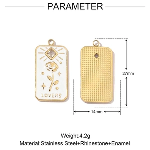 Detailed view of rectangular stainless steel pendant with white enamel flower and LOVERS text
