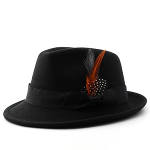 Close-up of black wool felt fedora featuring a decorative ribbon and colorful feathers