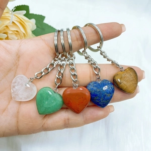 Set of five heart-shaped natural crystal keychains with various polished gemstones