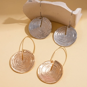 Minimalist geometric circular earrings in gold and silver finish with textured surface