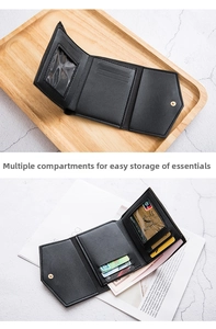 Detail view of black tri-fold wallet showing multiple card slots and clear ID window