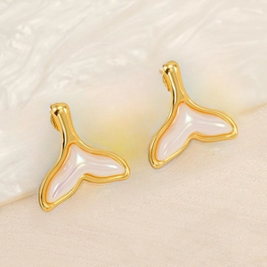Detailed close-up of 18K gold-plated fishtail studs with white pearlescent resin inlay